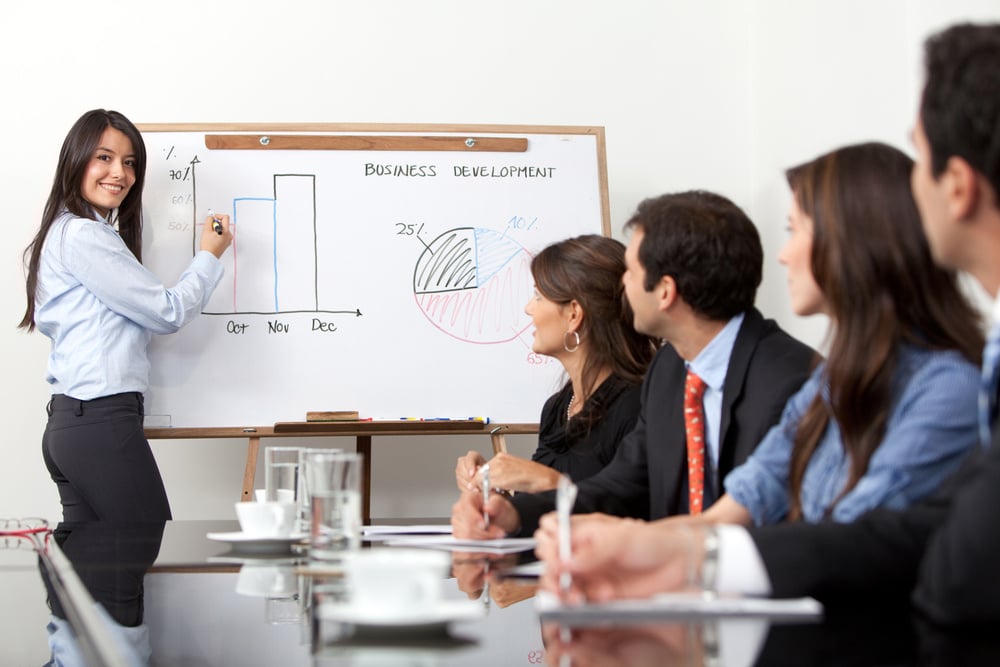 Woman making a business presentation to a group